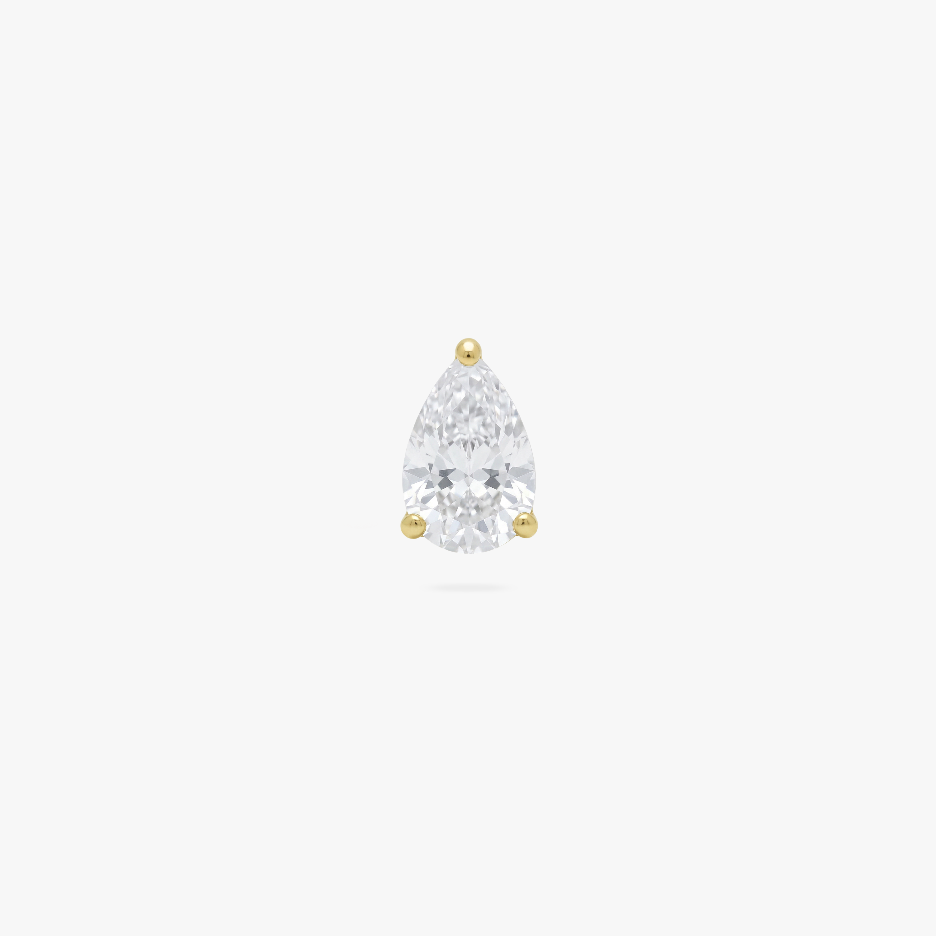 This is an image of a gold toned flatback stud displaying a 5mm clear, pear cut CZ stone. 
