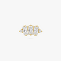 This is an image of a gold toned flatback stud which displays three clear, baguette cut CZ stones in a crown shape with two round, clear CZ stones on both ends of the crown. 