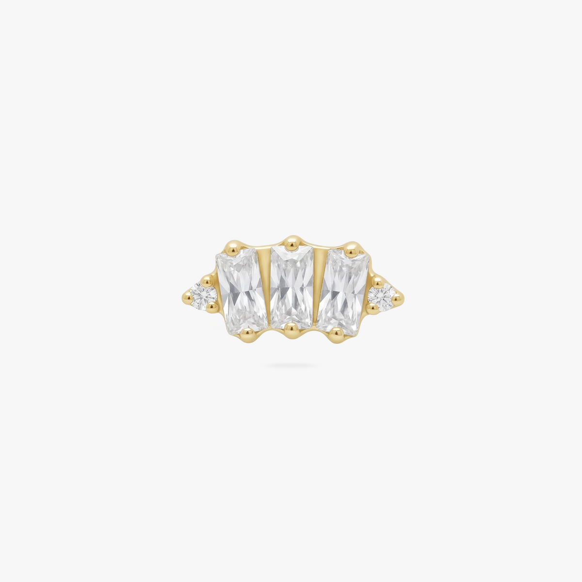 This is an image of a gold toned flatback stud which displays three clear, baguette cut CZ stones in a crown shape with two round, clear CZ stones on both ends of the crown. 