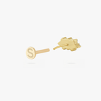This is an image of a gold toned flatback stud which displays three clear, baguette cut CZ stones in a crown shape with two round, clear CZ stones on both ends of the crown. 