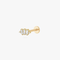 This is an image of a gold toned flatback stud which displays three clear, baguette cut CZ stones in a crown shape with two round, clear CZ stones on both ends of the crown. 