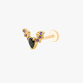 This image shows the side view of the golden titanium bat flatback with a center black cz stone and purple mini cz stones on the wings 
