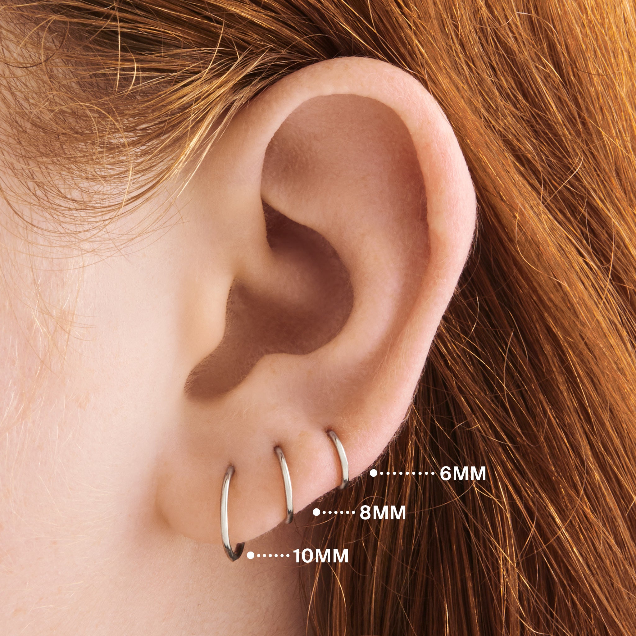 This is an image of a silver clicker with a 6mm inner diameter. color:null|silver