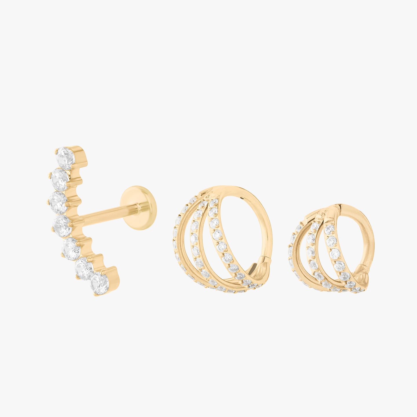 set featuring triple pave clickers and a curved cz flatback stud color:null|gold/clear