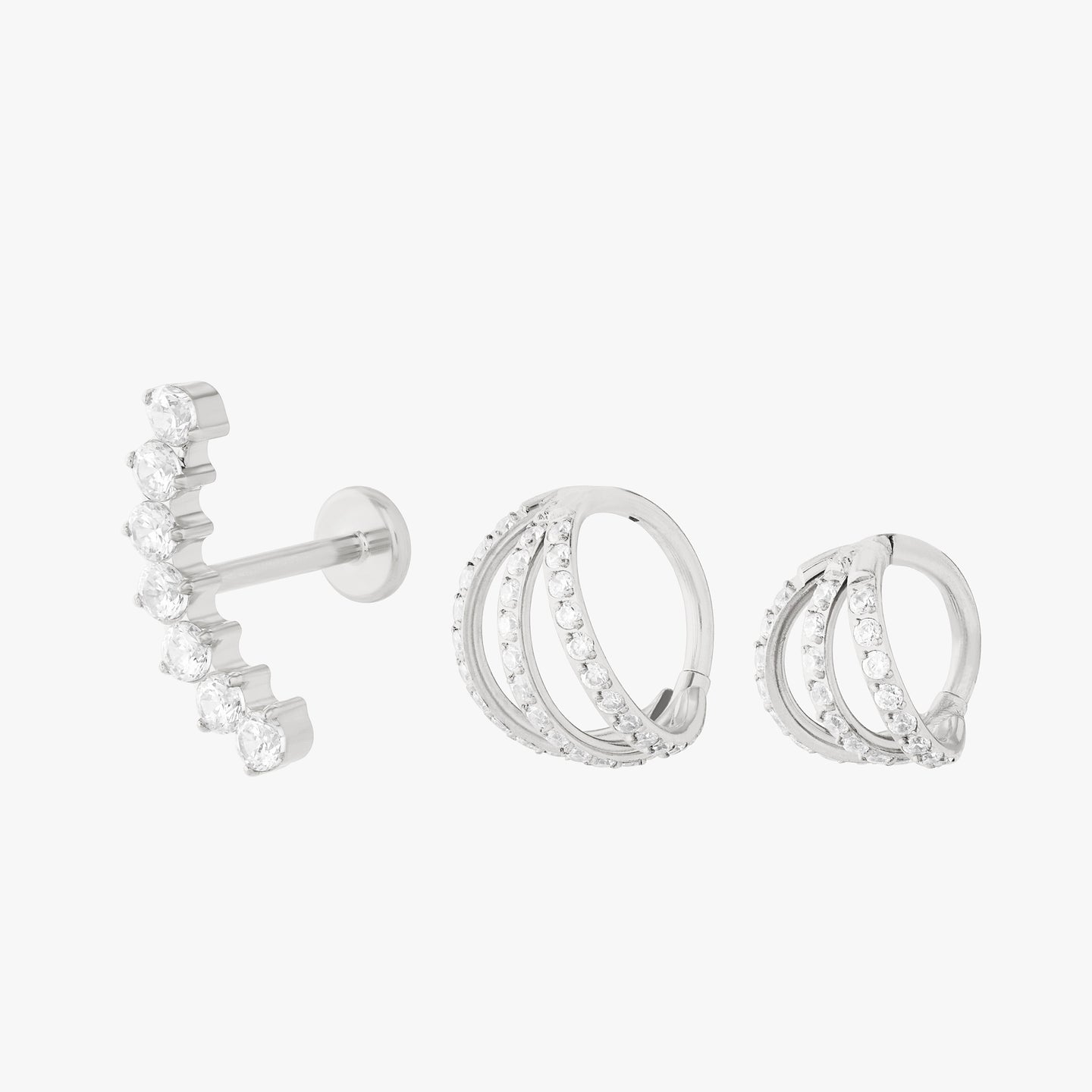 set featuring triple pave clickers and a curved cz flatback stud color:null|silver/clear