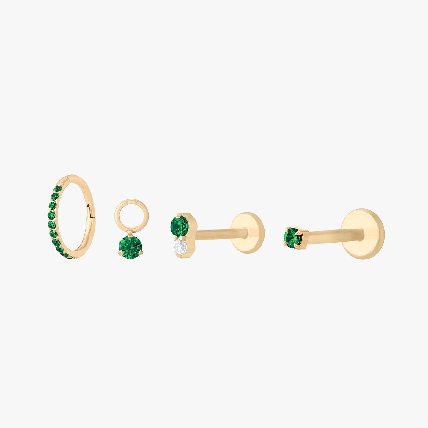 This is a set of earrings that are gold-toned with emerald stones. color:null|emerald