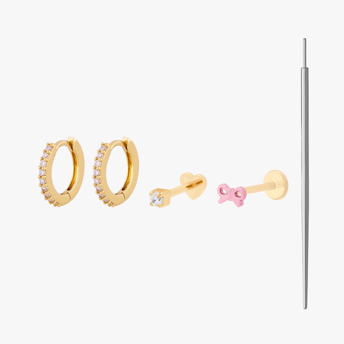 This is a set of gold-toned earrings including huggies, reversible flatbacks, and pink anodized flatbacks. color:null|gold