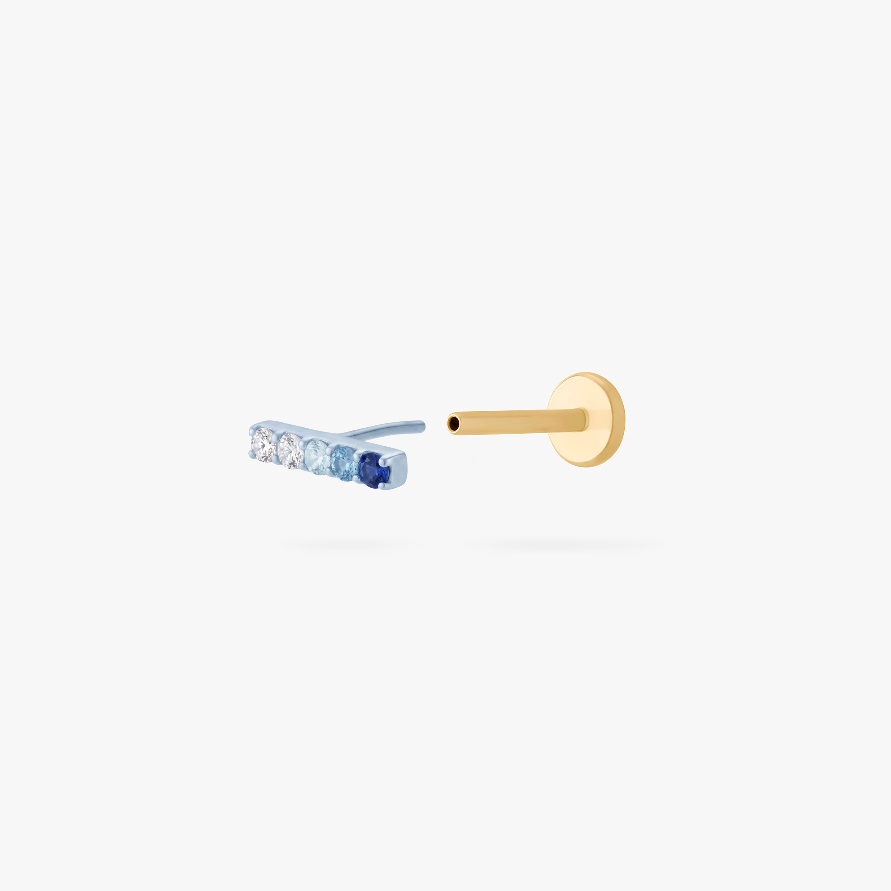 This is an image of an anodized blue flatback stud with a gradient of 5 blue CZ stones creating a pave bar. The flatback post for this earring is gold toned. - Alternative view 2