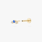 this image shows a gold plated micro cluster flatback with two clear and one blue cz stones