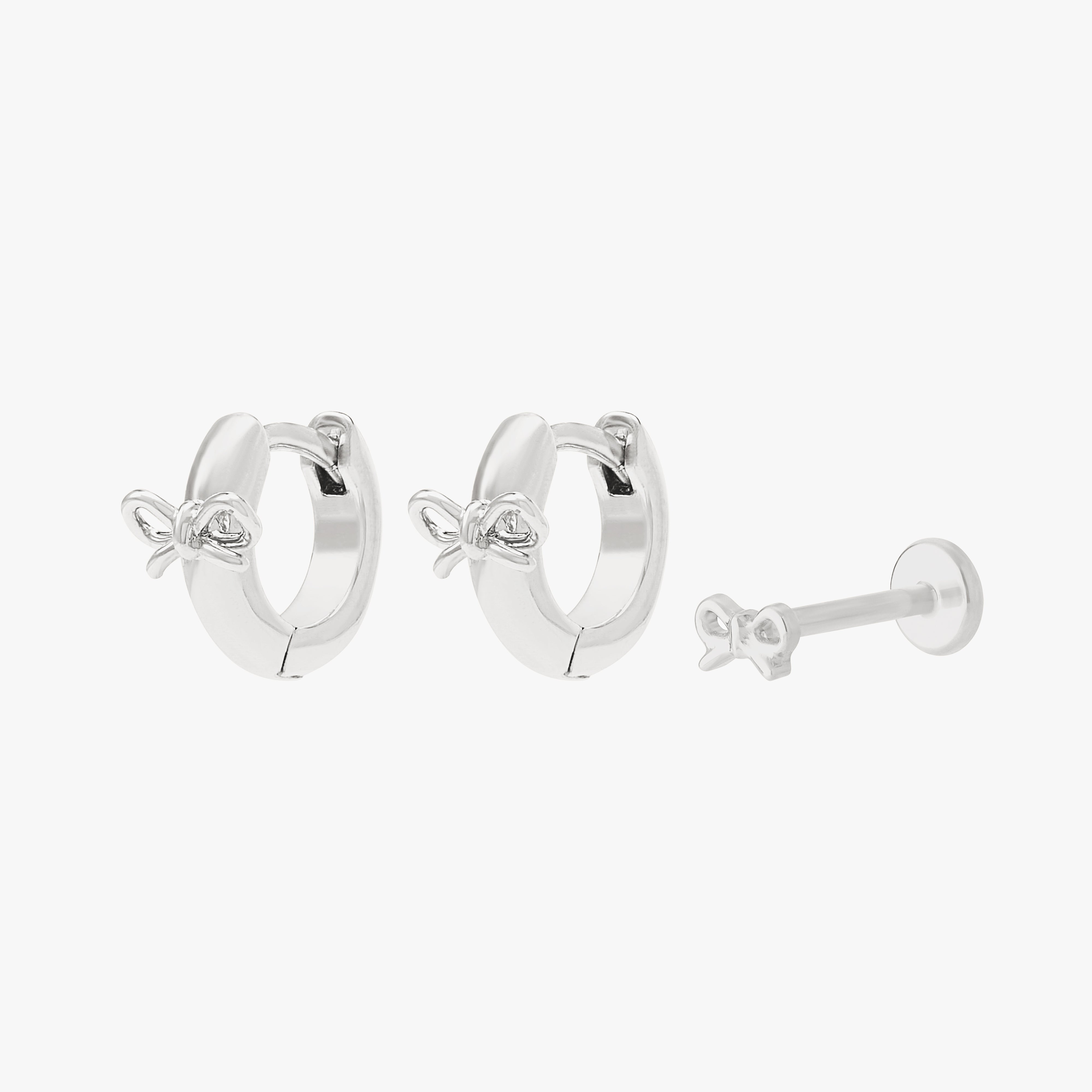 Silver earscape featuring a pair of bow huggies and a bow flatback stud - Main view