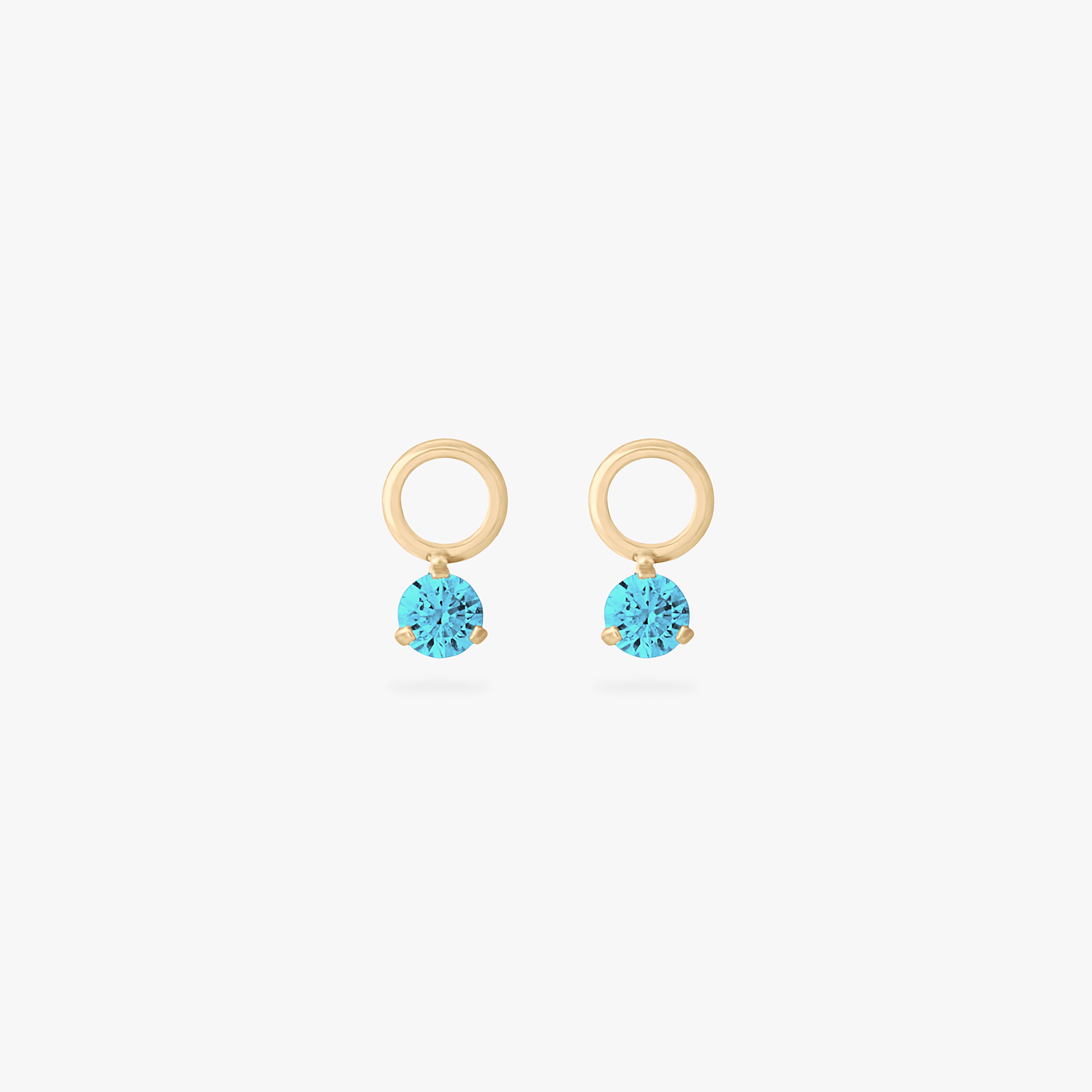 This is an image of a pair of gold charms for a clicker that have micro aquamarine cz's on them. [pair] color:null|aquamarine