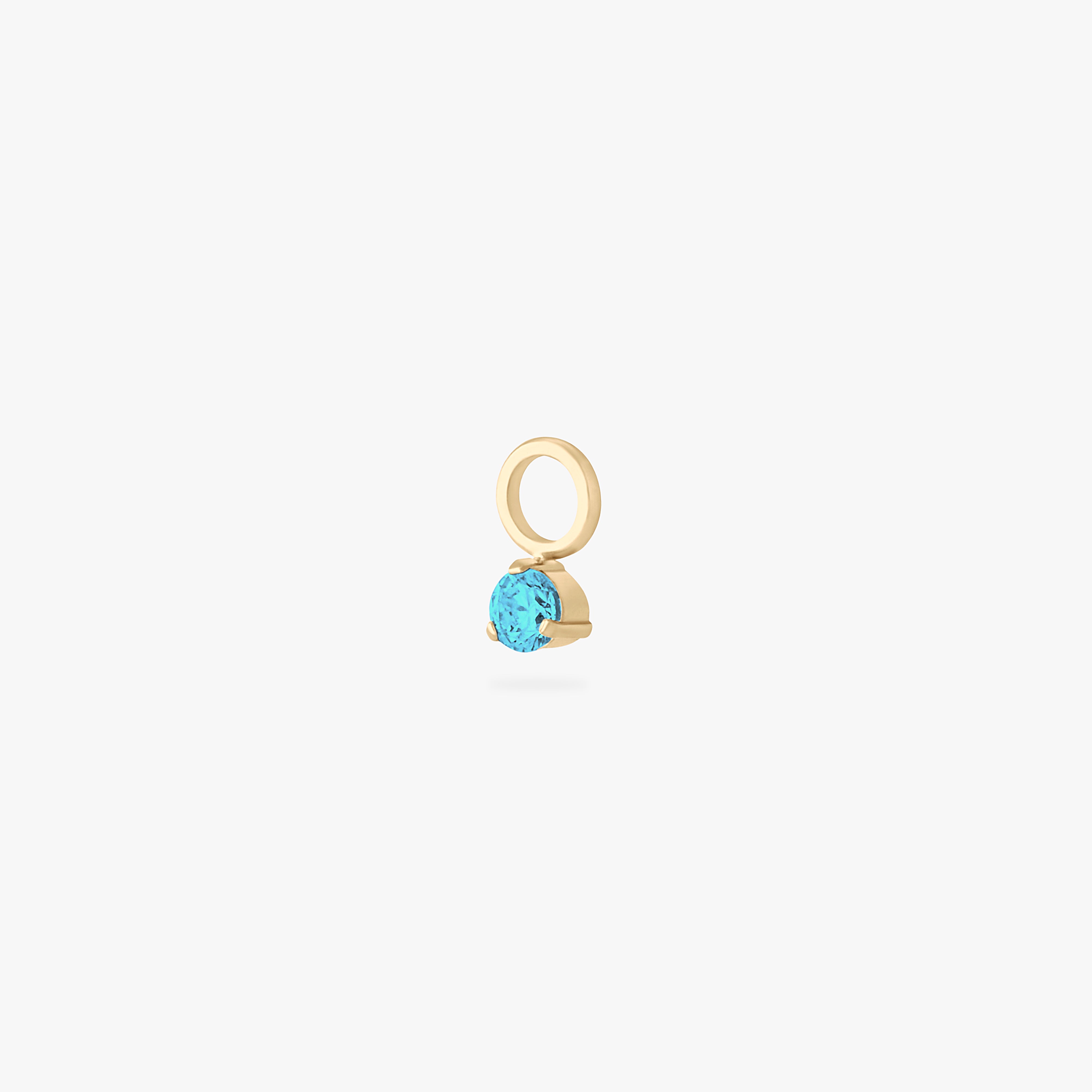 This is an image of a gold charm for a clicker that has a micro aquamarine cz on it. color:null|aquamarine