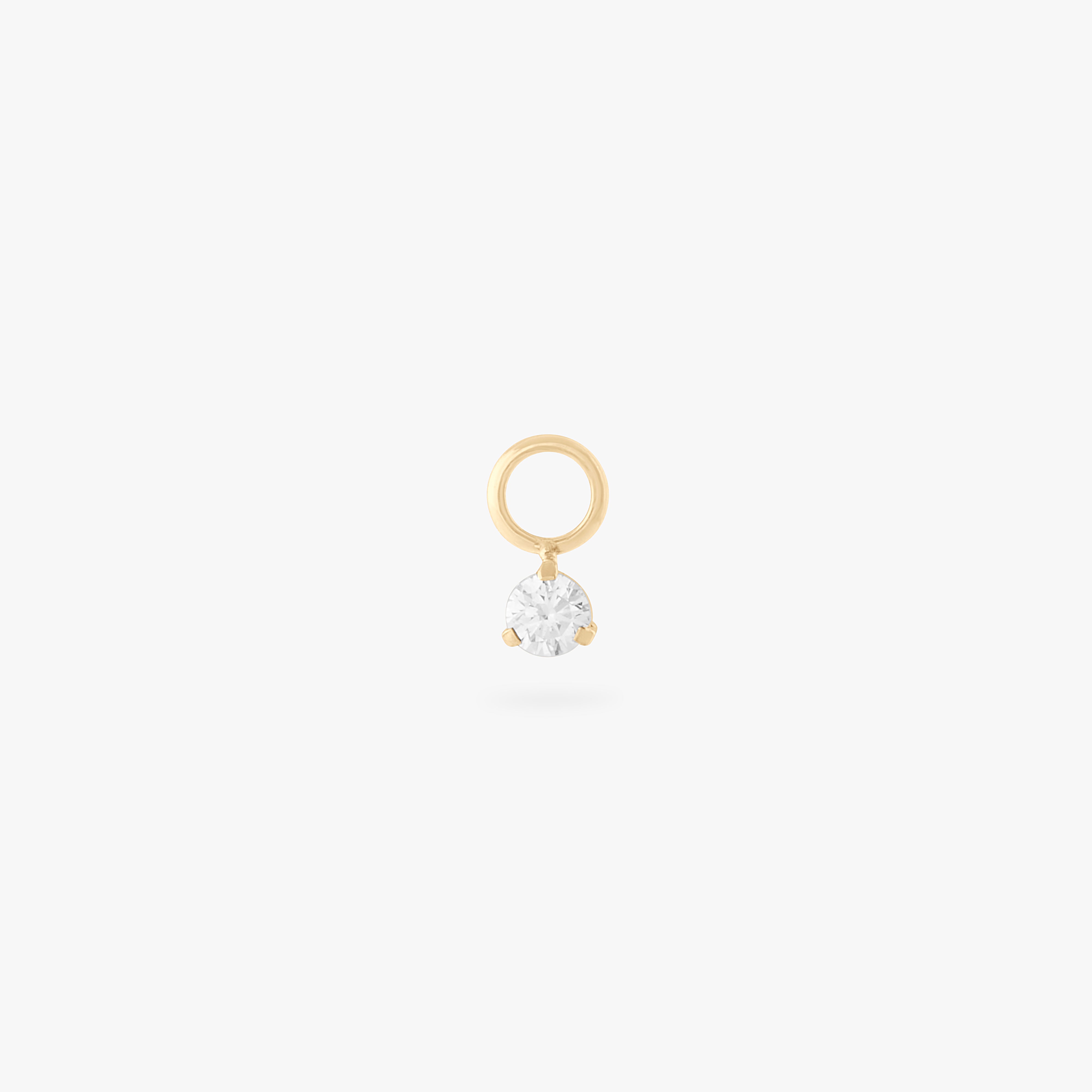 This is an image of a gold charm for a clicker that has a micro crystal cz on it. color:null|crystal