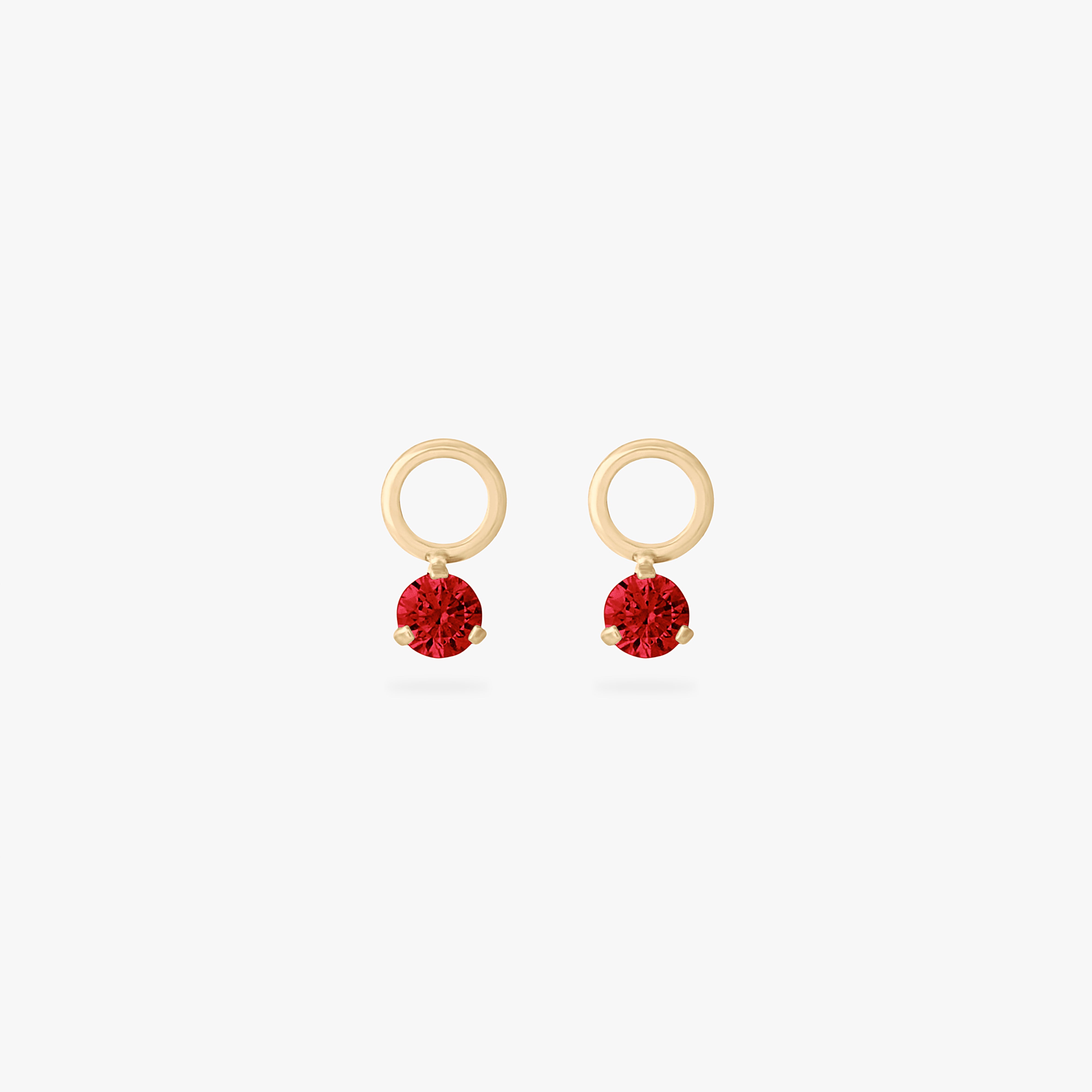This is an image of a pair of gold charms for a clicker that have micro garnet cz's on them. [pair] color:null|garnet
