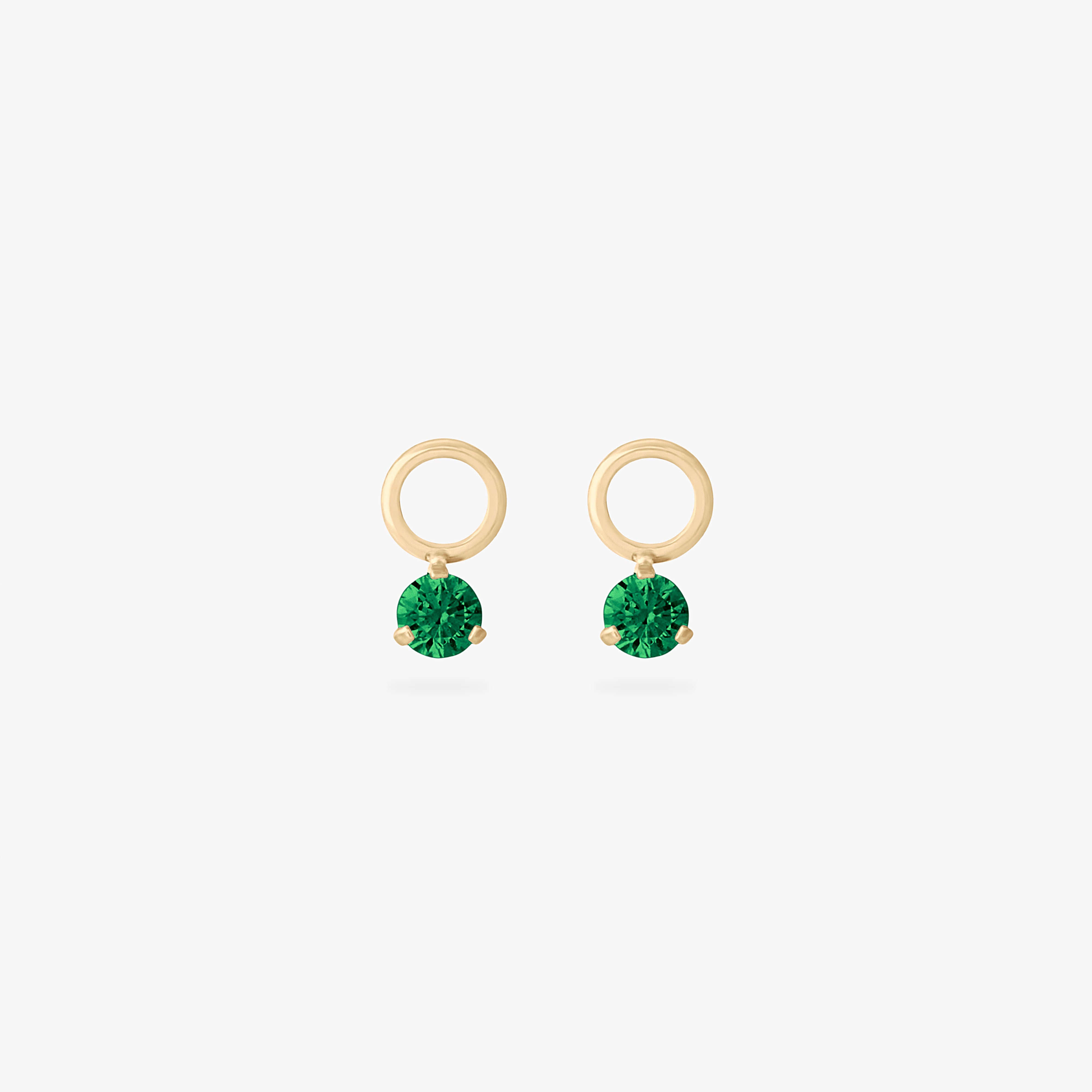 This is an image of a pair of gold charms for a clicker that have micro emerald cz's on them. [pair] color:null|emerald