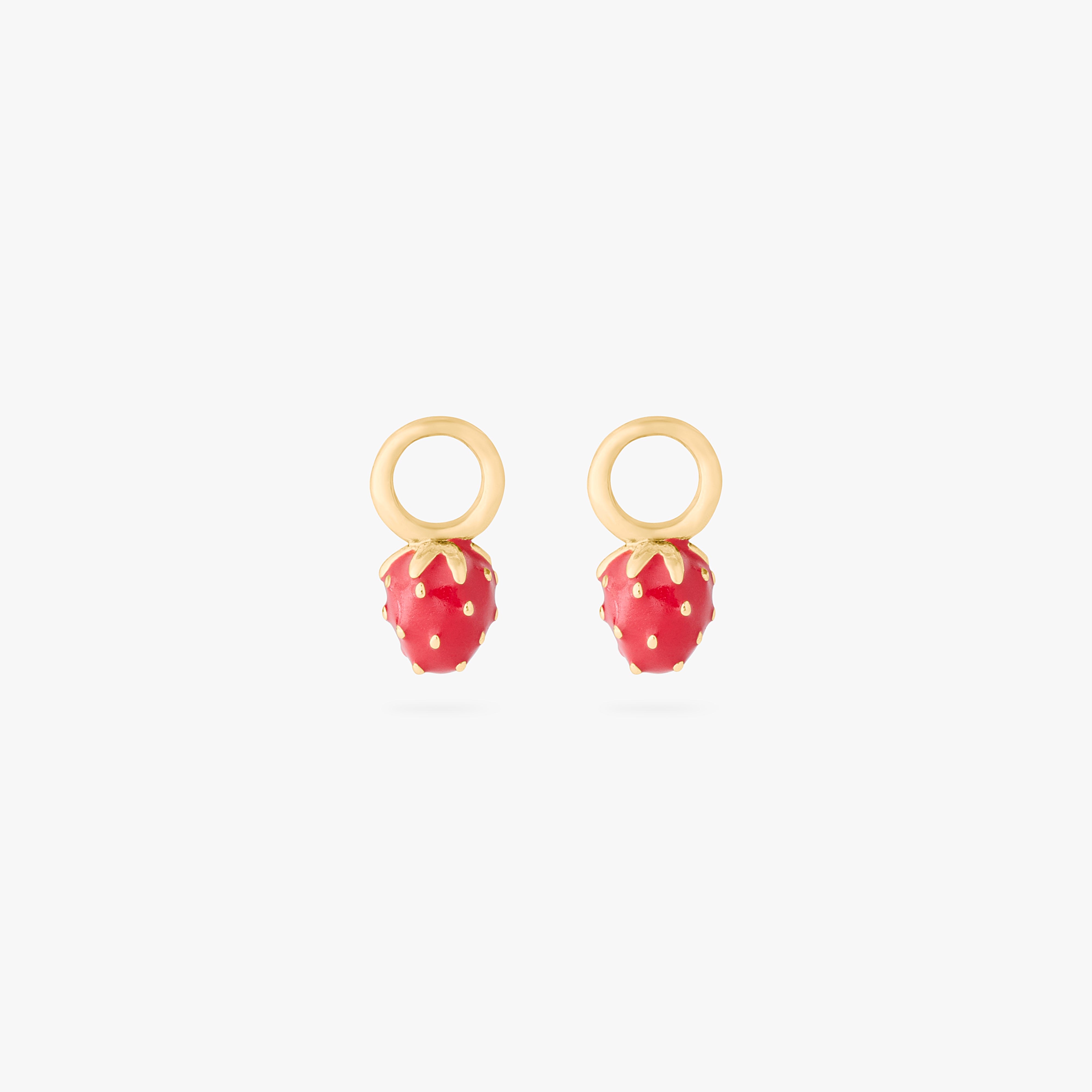 This is an image of a pair of gold earring charms in the shape of strawberries with red enameling. [pair] color:null|gold/red