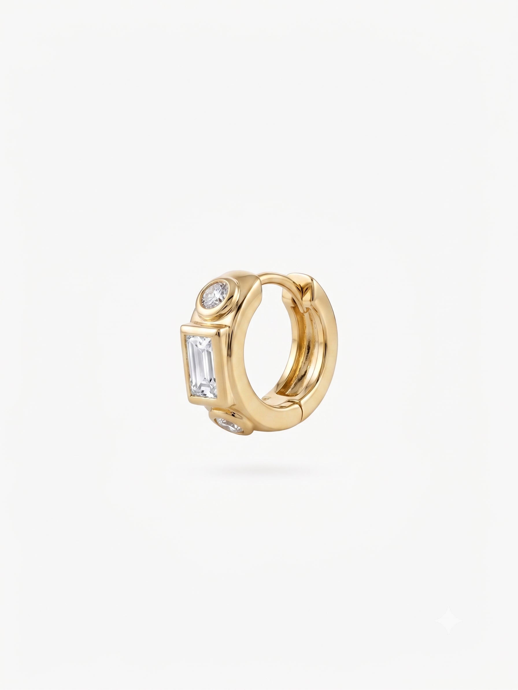 This image shows the front view of a 14k gold plated huggie with three clear cz stones. One square in the middle and two circular stones on the outside. - Main view