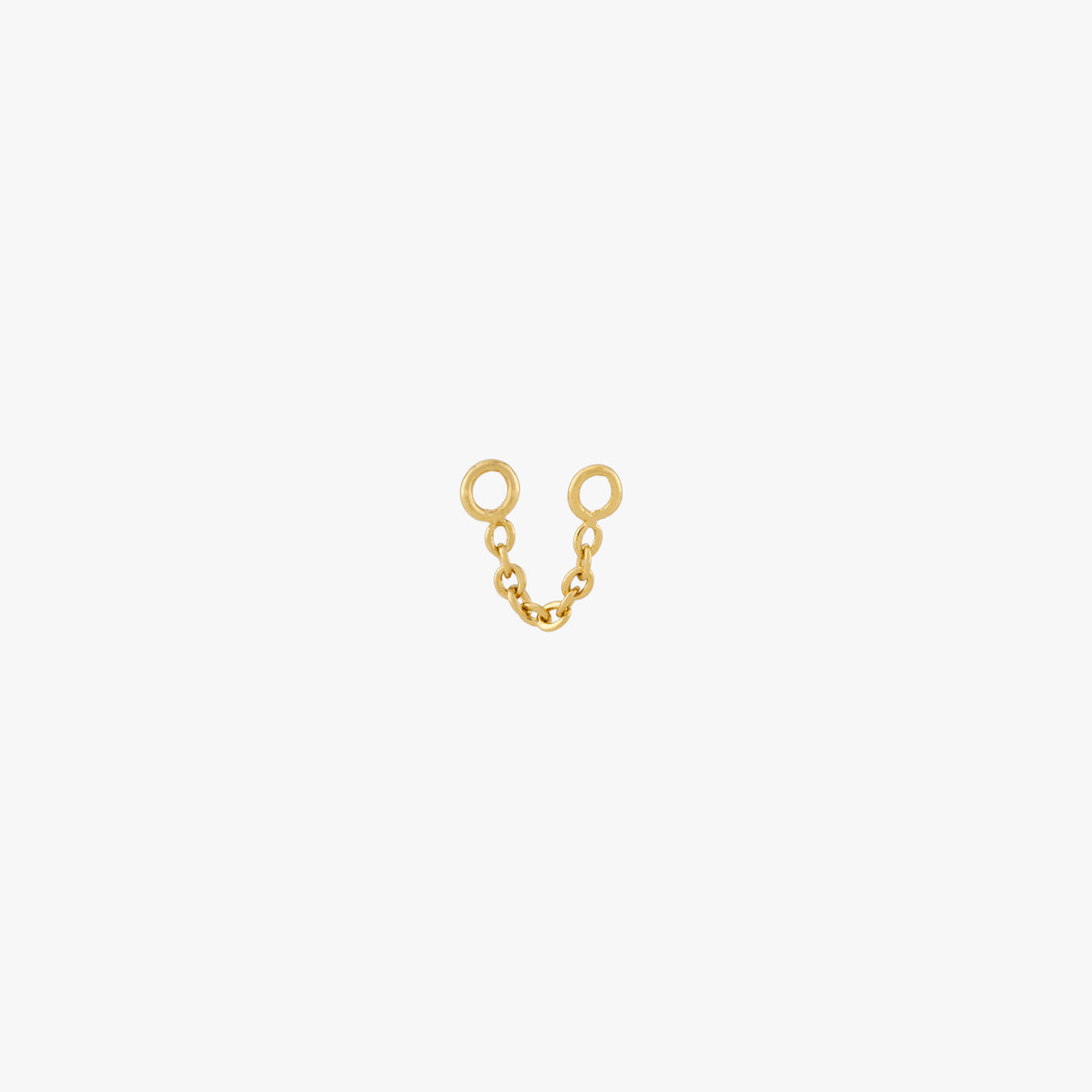 This is an image of a gold toned chain that is 2mm in length with two jump rings at the ends against a white background. 