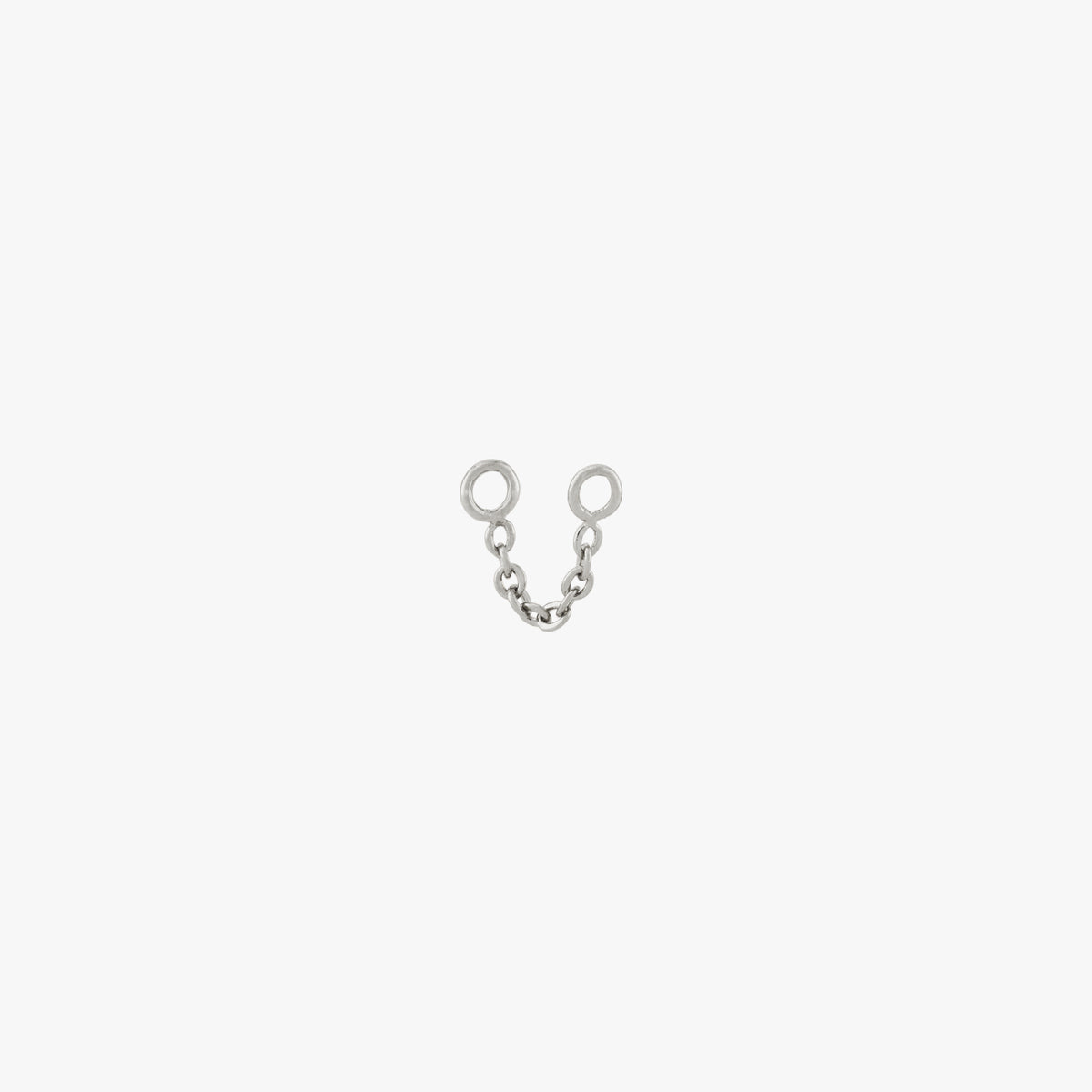 This is an image of a silver toned chain that is 2mm in length with two jump rings at the ends against a white background. 