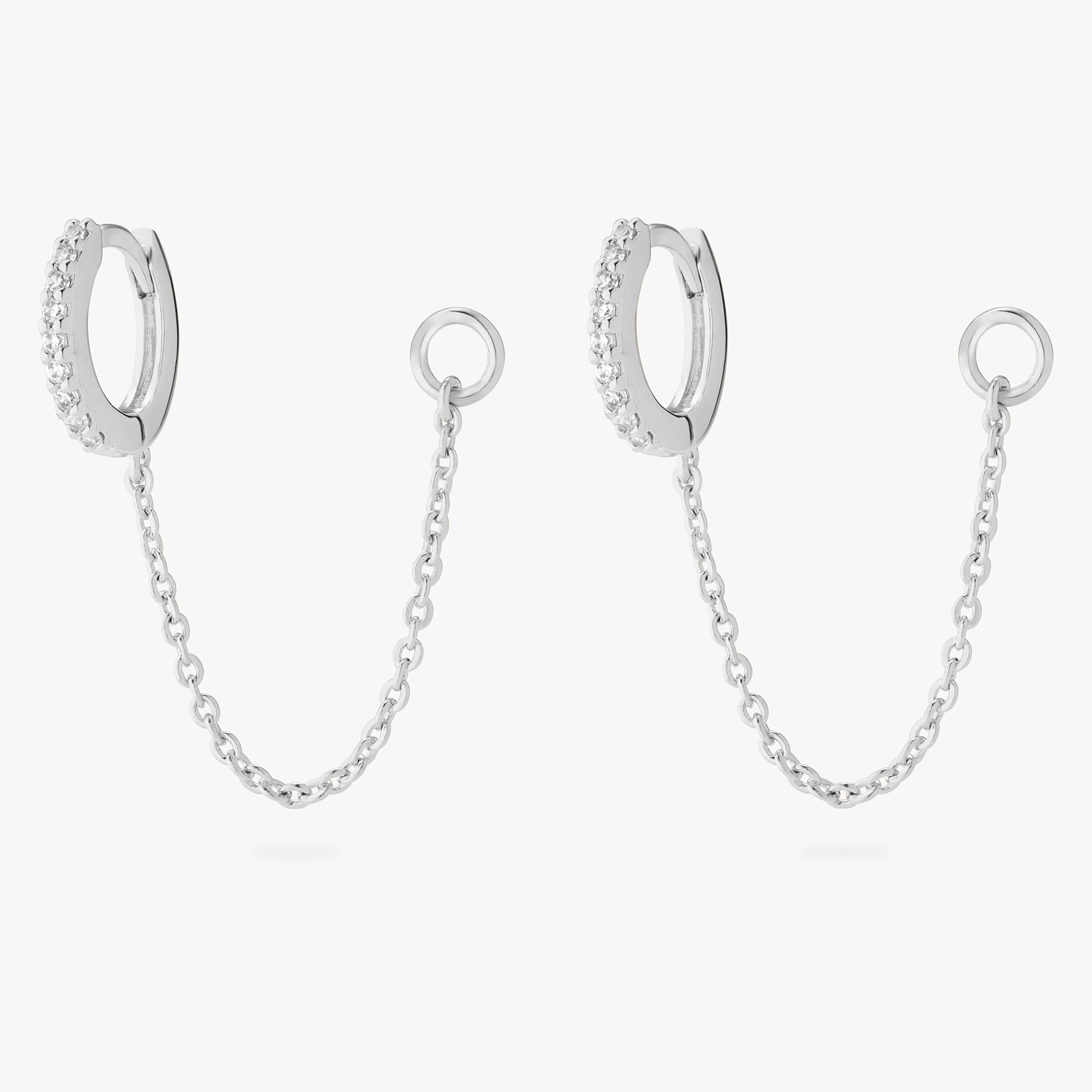 An image of a silver/clear mini pave huggies with connector chains to open 4mm wide jump ring. [hover] color:null|silver/clear