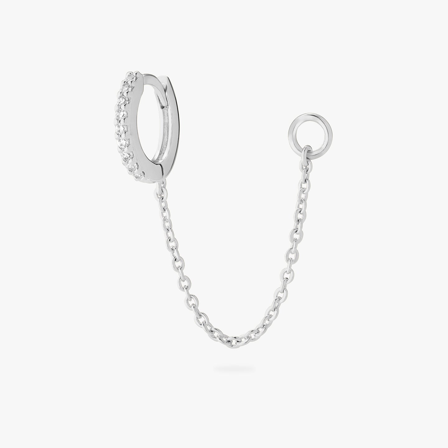 An image of a silver/clear mini pave huggie with a connector chain to an open 4mm wide jump ring. color:null|silver/clear