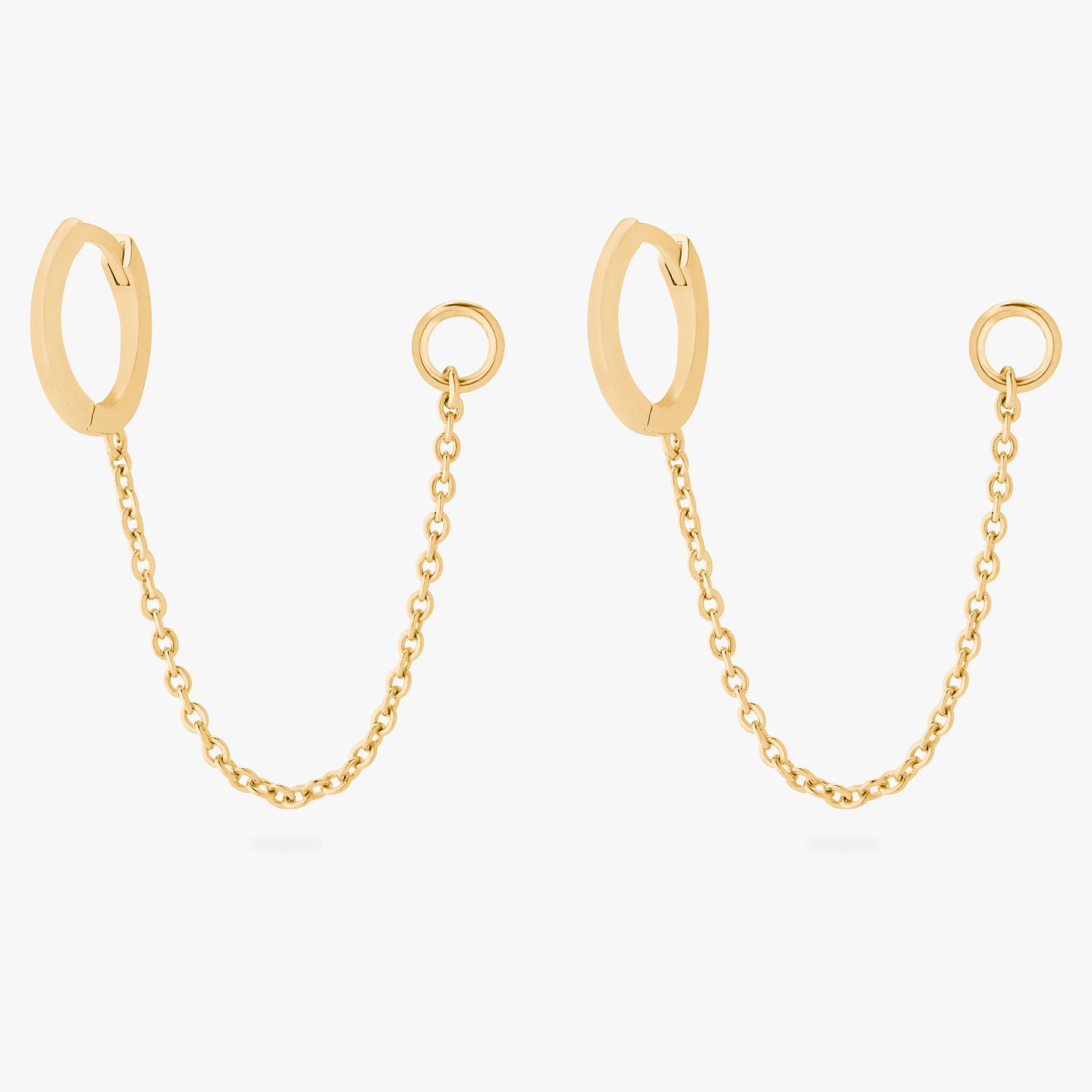 A pair of gold small slim huggies with connector chains that have a 4mm open jump ring. [pair] color:null|gold
