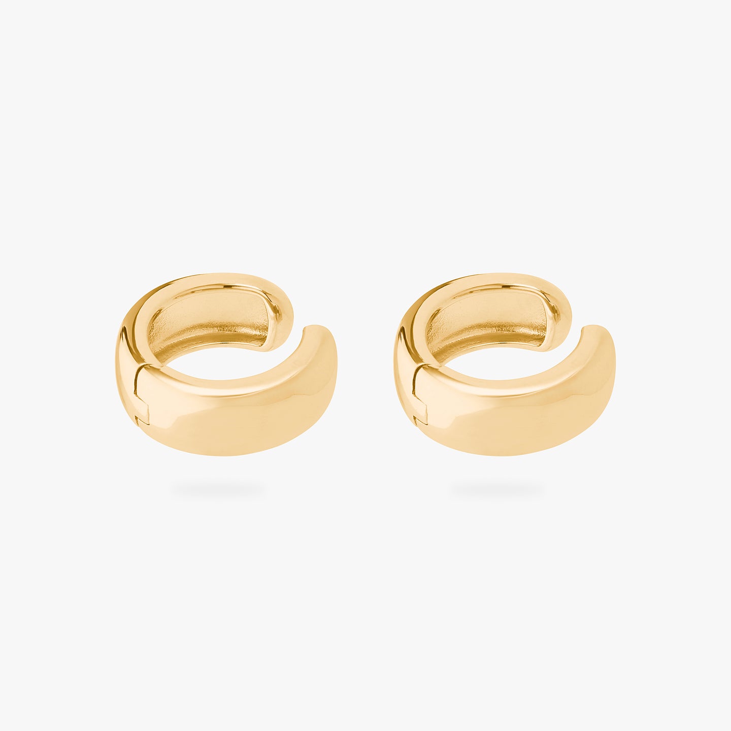 This is a pair of gold, chunky shaped ear cuffs. [pair] color:null|gold