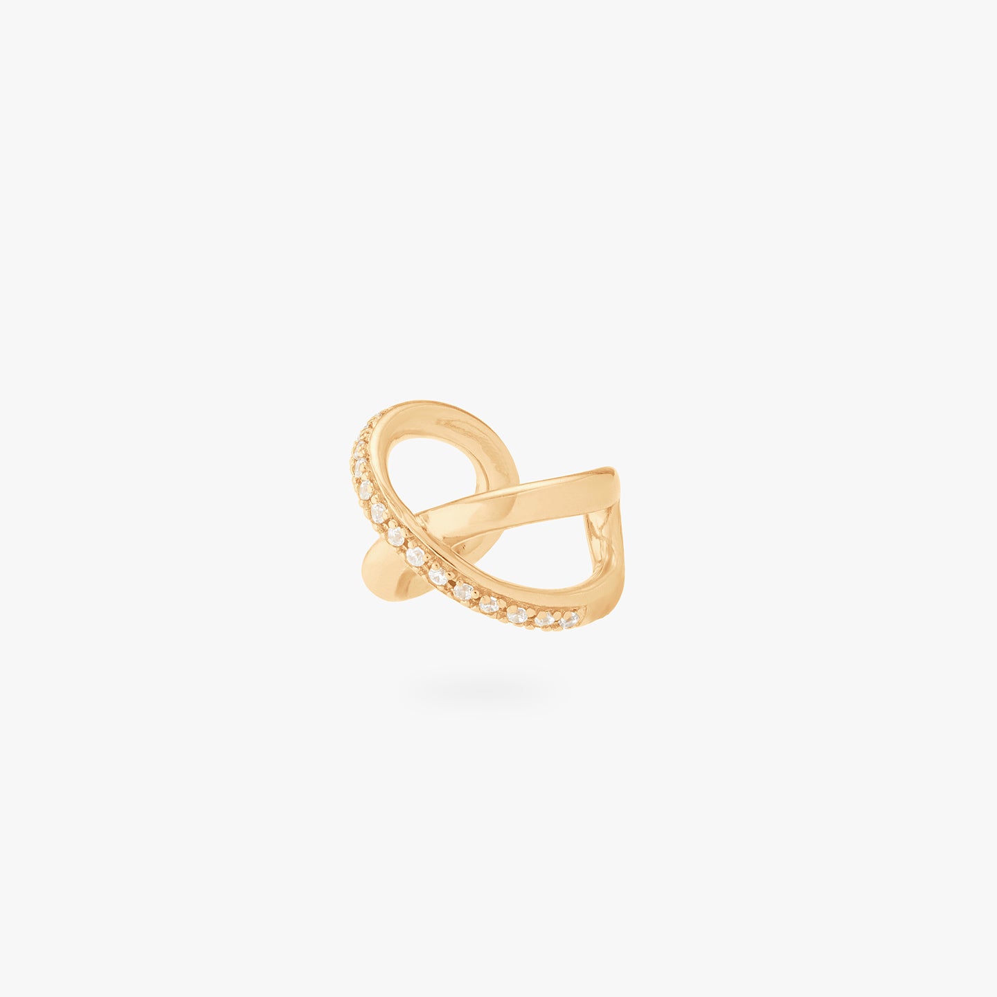 This is an image of a gold twist cuff that has one side of the twist diagonally lined with gold/clear CZs. color:null|gold/clear