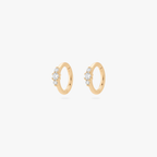 Pair of Gold clicker earrings with small cz stones on a white background