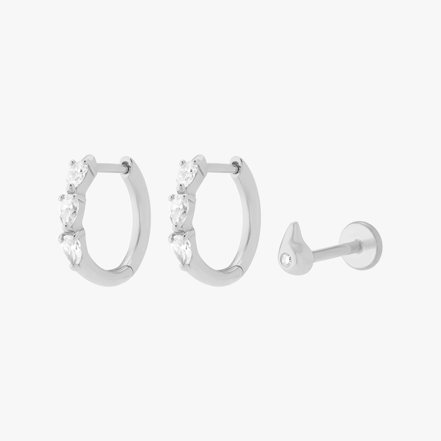 white gold set of diamond huggies and a flatback stud color:null|silver/clear