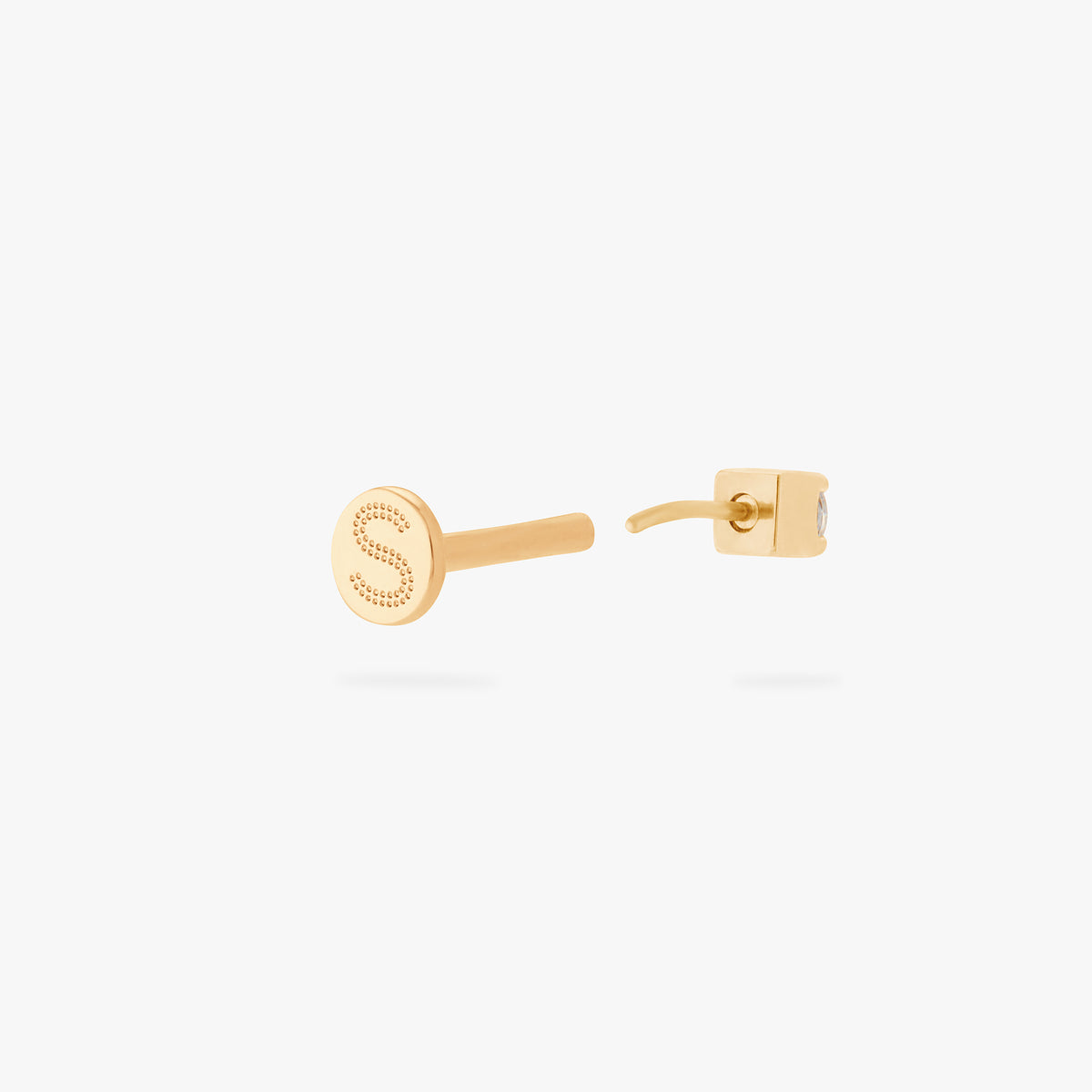 This is an image of a gold/clear mini CZ flatback top with a gold circle dic that is engraved with the "S" logo. color:null|gold/clear
