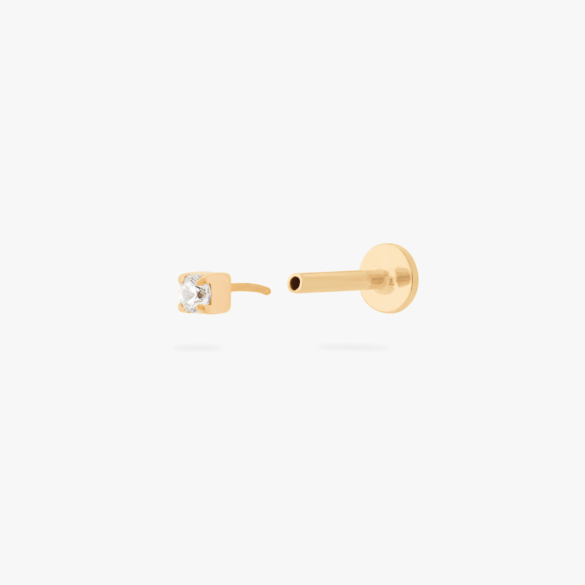 This is an image of a gold/clear mini CZ flatback top with a gold circle dic that is engraved with the "S" logo. color:null|gold/clear
