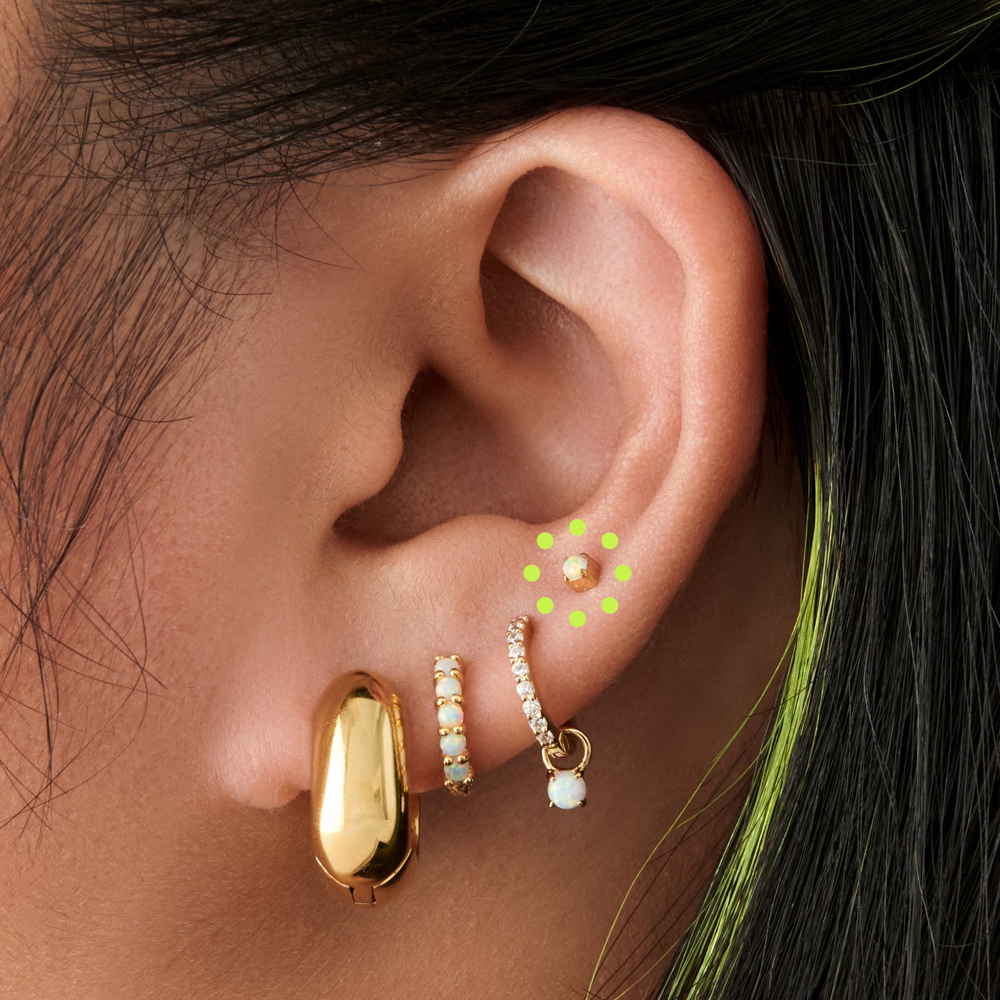 This is an image of a gold/opal flatback top with a gold labret with a circle disc and the 