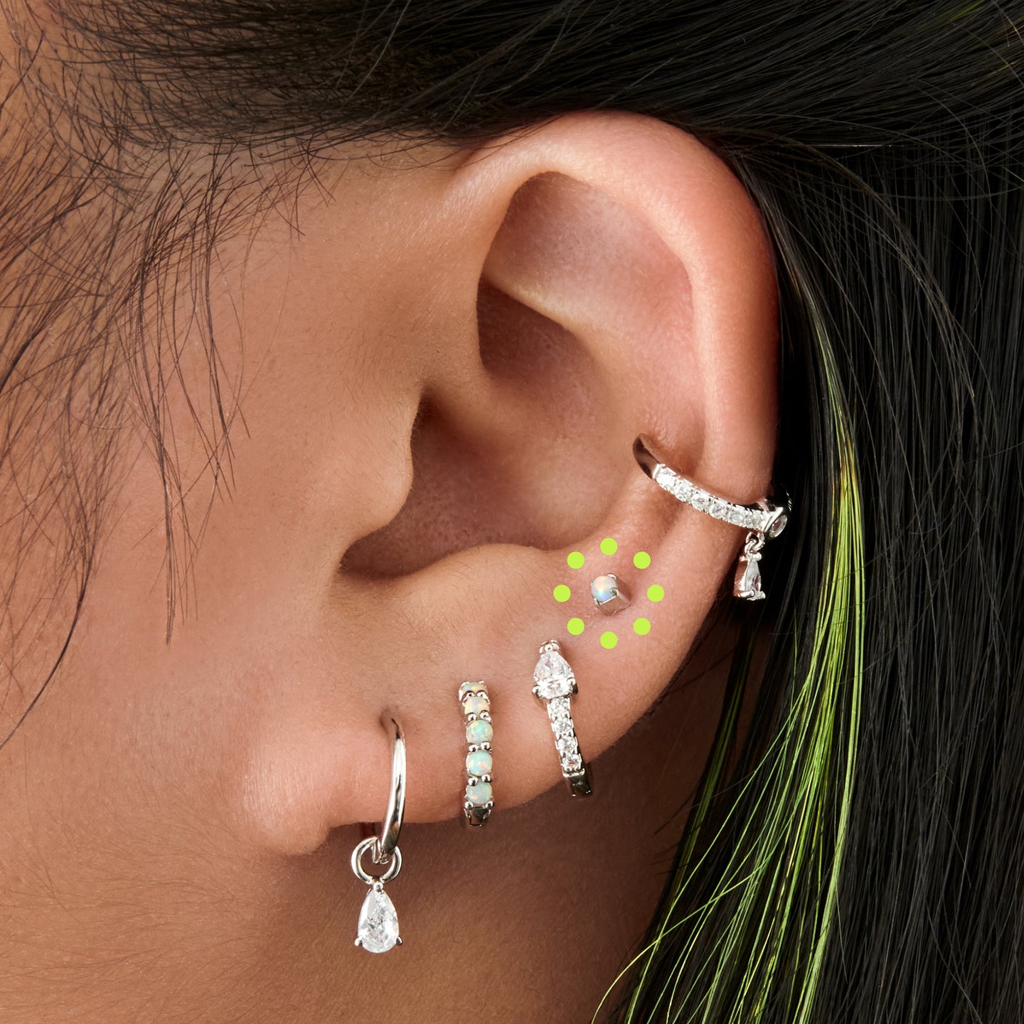 This is an image of a silver/opal flatback top with a silver labret with a circle disc and the 