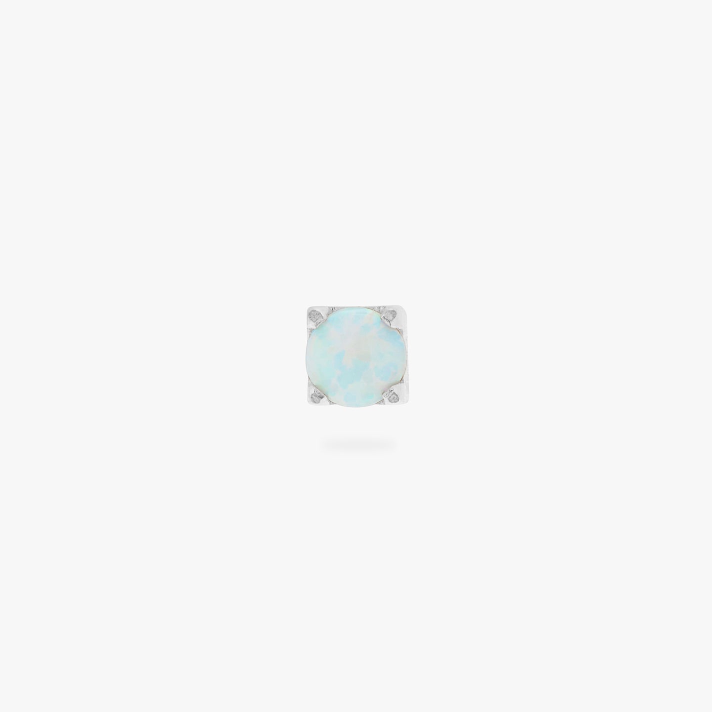 This is an image of a silver/opal flatback top with a silver labret with a circle disc and the 