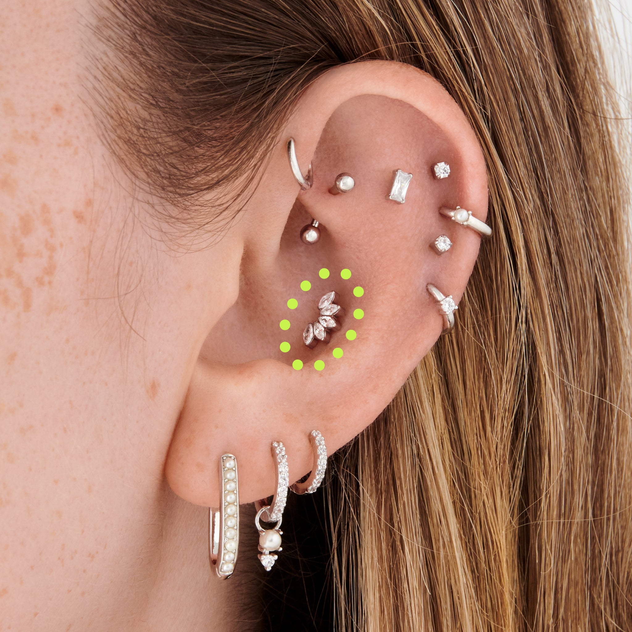 This is an image of a silver/clear crown shaped flatback top that has 5 marquise shaped CZs, with a silver labret that has a circle disc engraved with the "S" on it. [hover] color:null|silver/clear