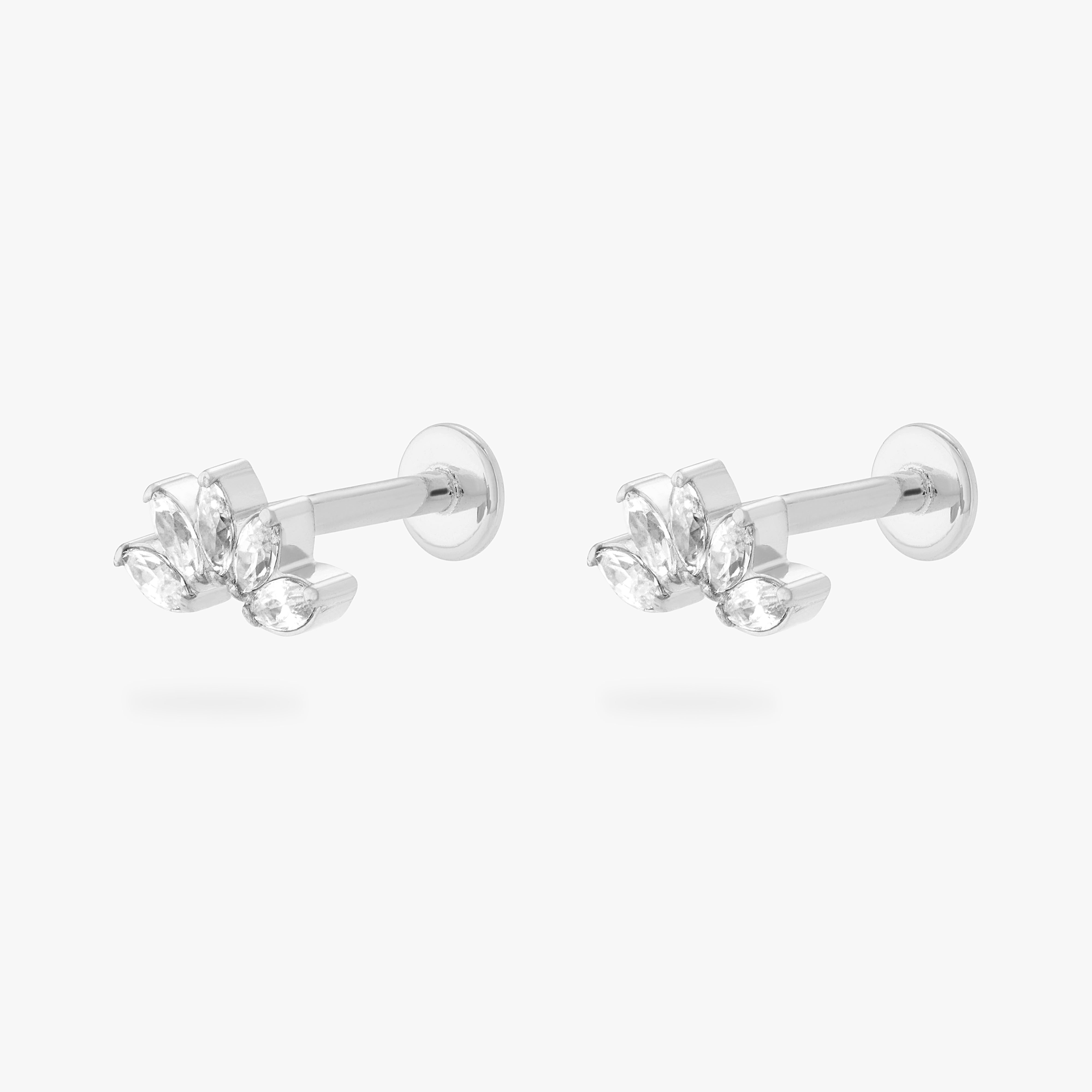 This is an image of a pair of silver/clear crown shaped flatback tops that have 5 marquise shaped CZs, with silver labrets that have circle discs engraved with the "S" on them. [pair] color:null|silver/clear