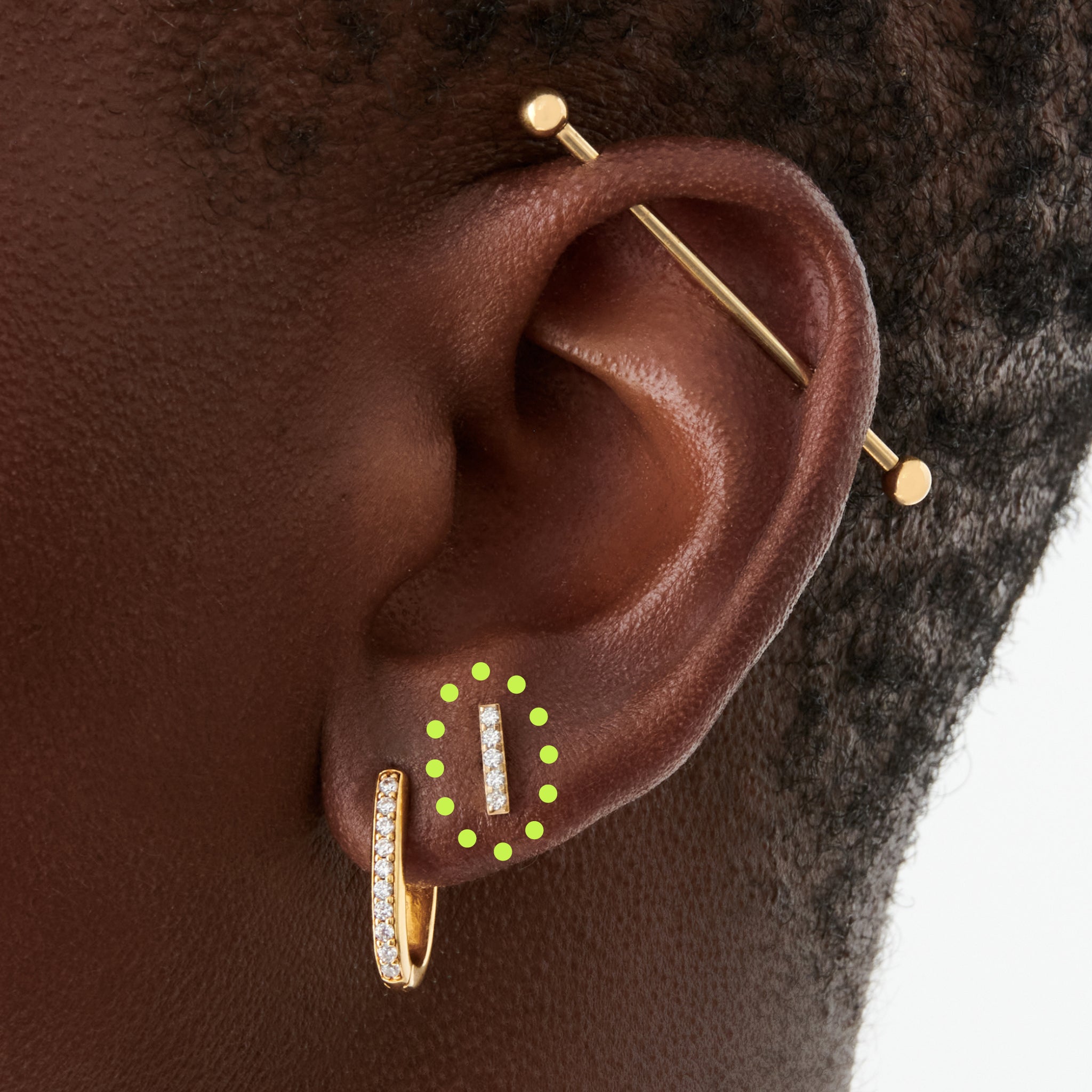 This is an image of a gold/clear bar that has 5 mini CZs in a line formation with a gold labret with a circle disc and the "S" logo engraved in it. [hover] color:null|gold/clear