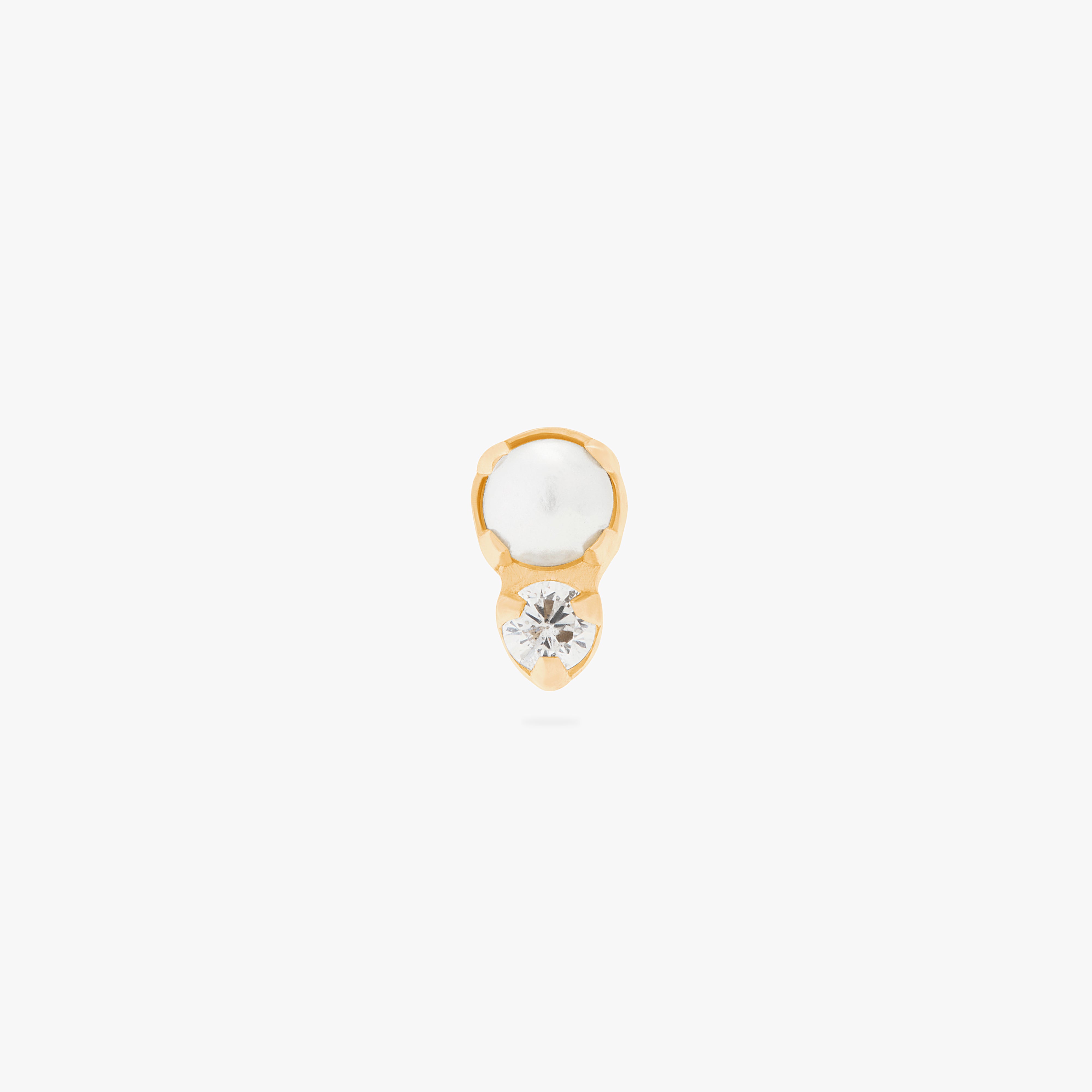 This is an image of a flatback top which has a pearl stacked over gold/clear CZ and then a gold labret that has a circle disc with the "S" logo engraved on it. color:null|gold/clear