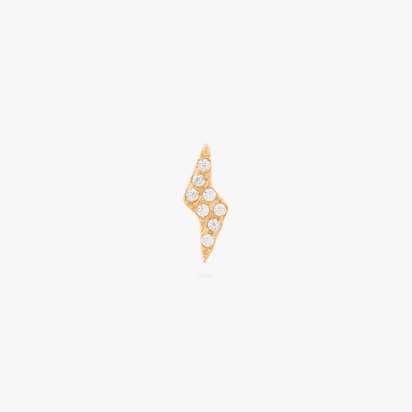 This is an image of a gold/clear pave lightning-bolt shaped flatback top with a gold labret with a circle disc that has an 
