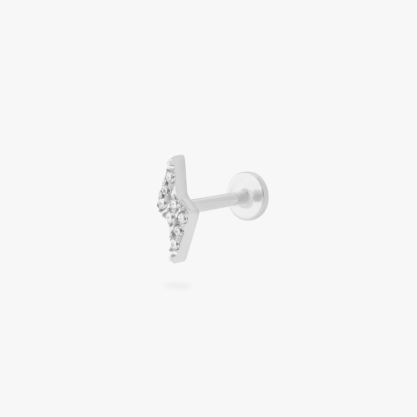 This is an image of a silver/clear pave lightning-bolt shaped flatback top with a silver labret with a circle disc that has an 