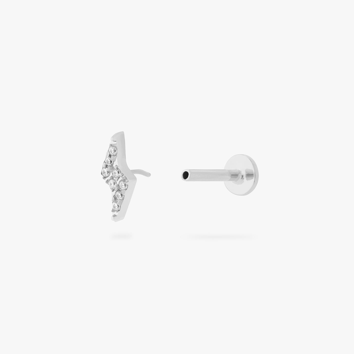 This is an image of a silver/clear pave lightning-bolt shaped flatback top with a silver labret with a circle disc that has an 