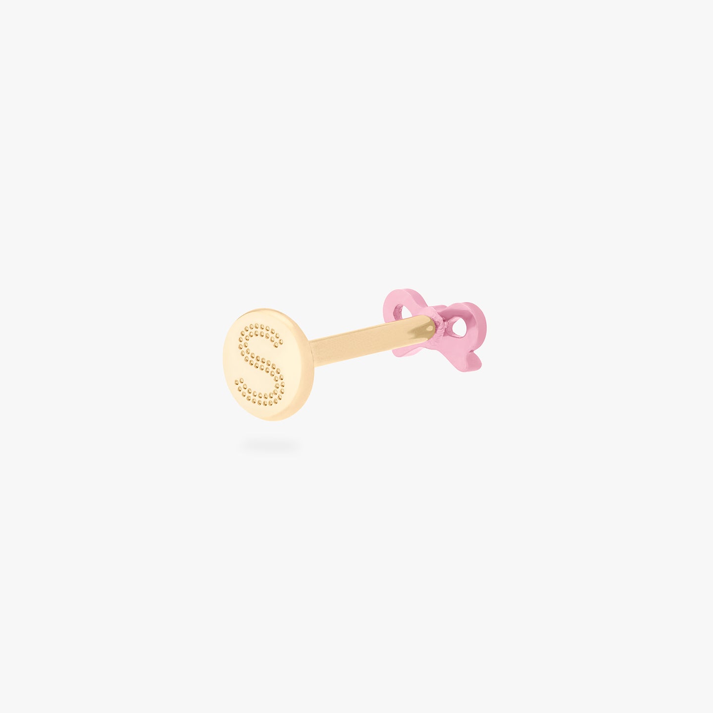 This image is of a pink bow-shaped flatback stud made out of titanium with a gold-toned labret back on facing opposite of the camera. color:null|pink