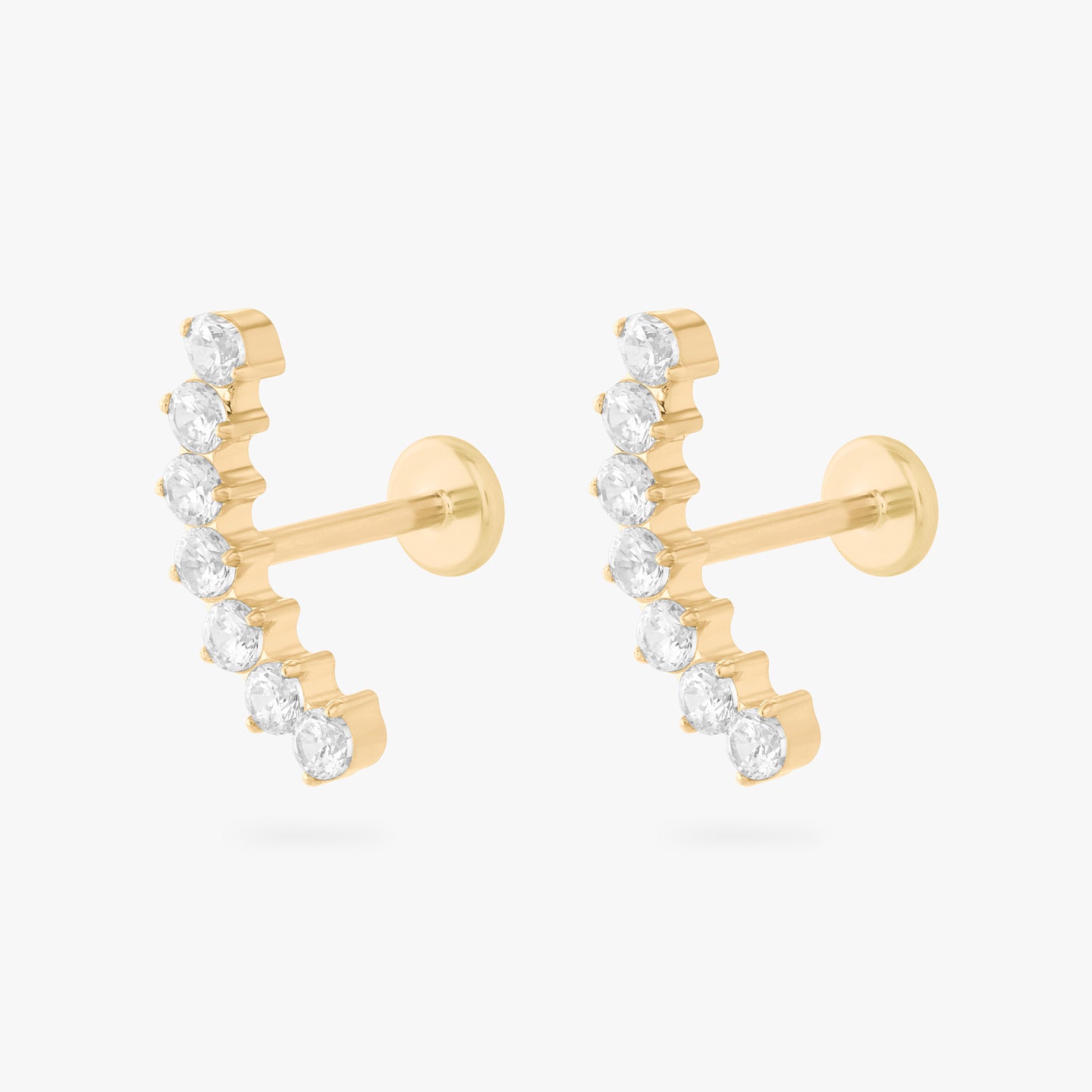 a flatback stud with a curved row of cz stones in gold [pair] color:null|gold/clear