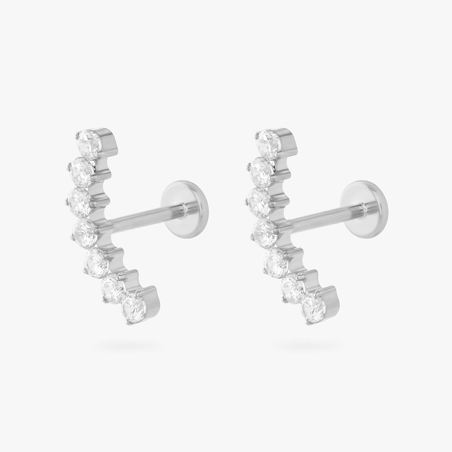 a flatback stud with a curved row of cz stones in silver [pair] color:null|silver/clear