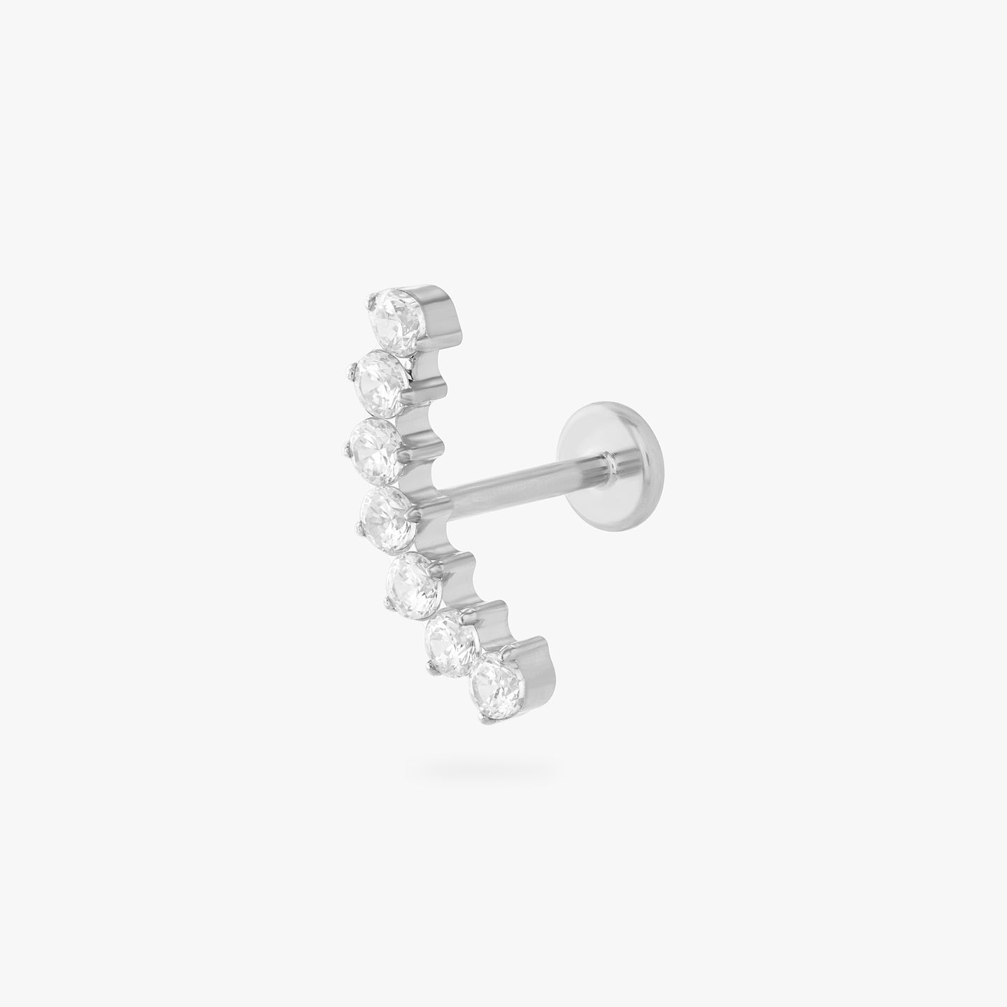 a flatback stud with a curved row of cz stones in silver color:null|silver/clear