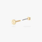 This is an image of a 14K yellow gold PVD plated titanium flatback stud with a clear CZ stone.