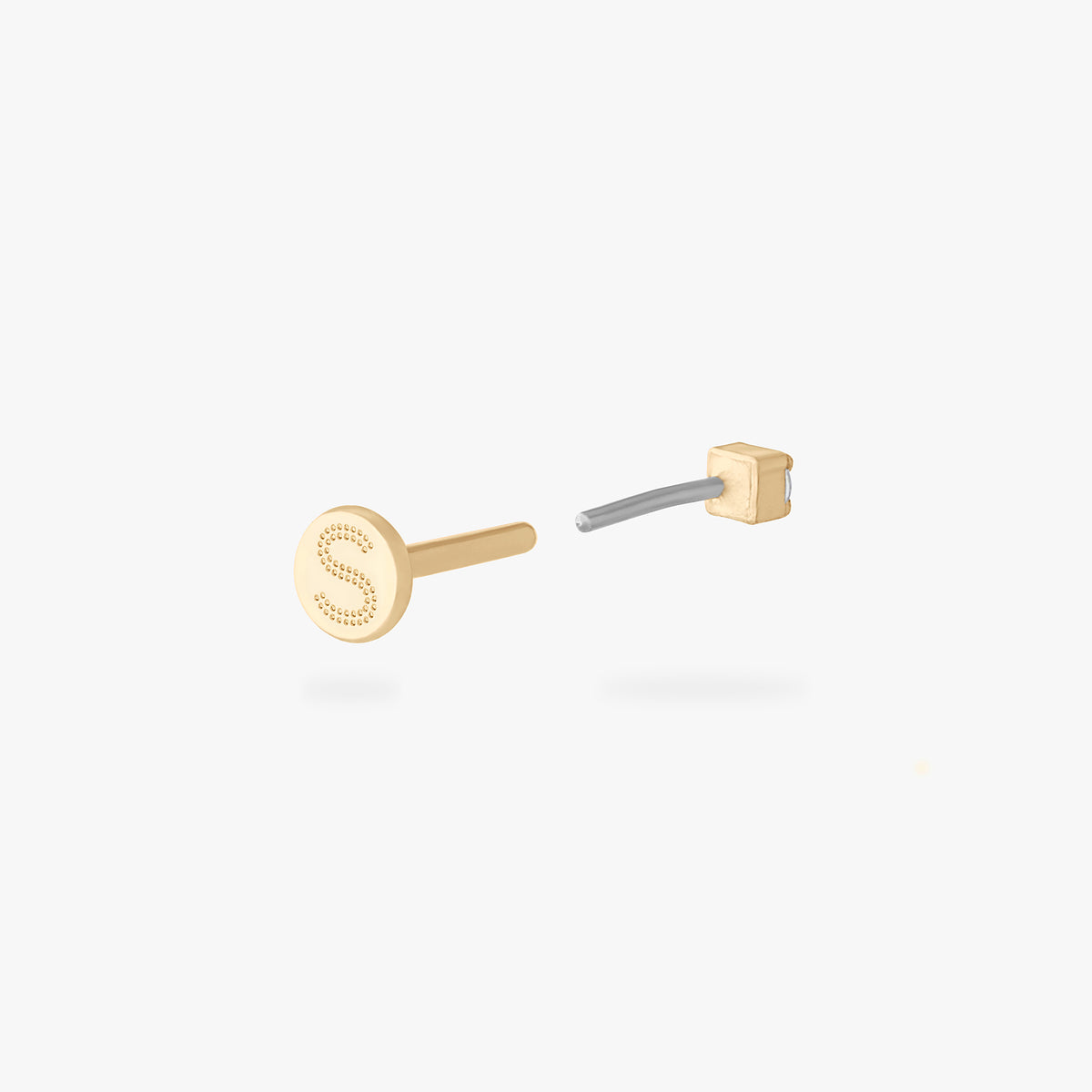 This is an image of a 14K yellow gold PVD plated titanium flatback stud with a clear CZ stone.