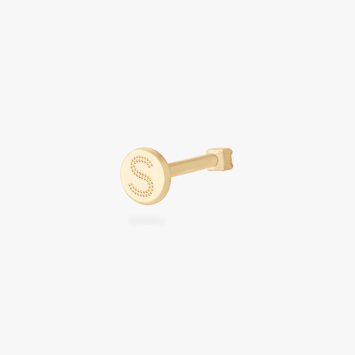 This is an image of a 14K yellow gold PVD plated titanium flatback stud with a clear CZ stone.