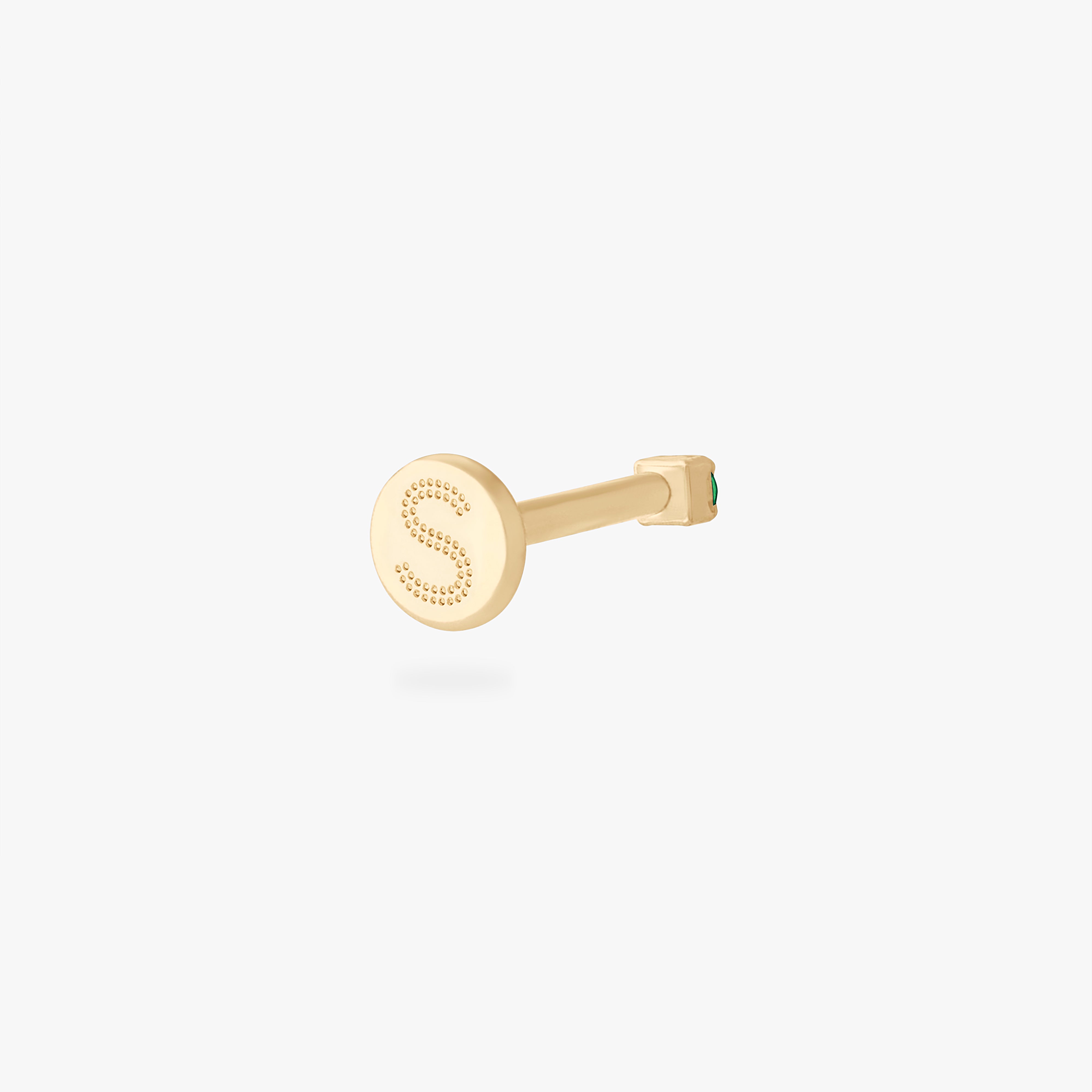 This is an image of a 14K yellow gold PVD plated titanium flatback stud with a green CZ stone. - Alternative view 3